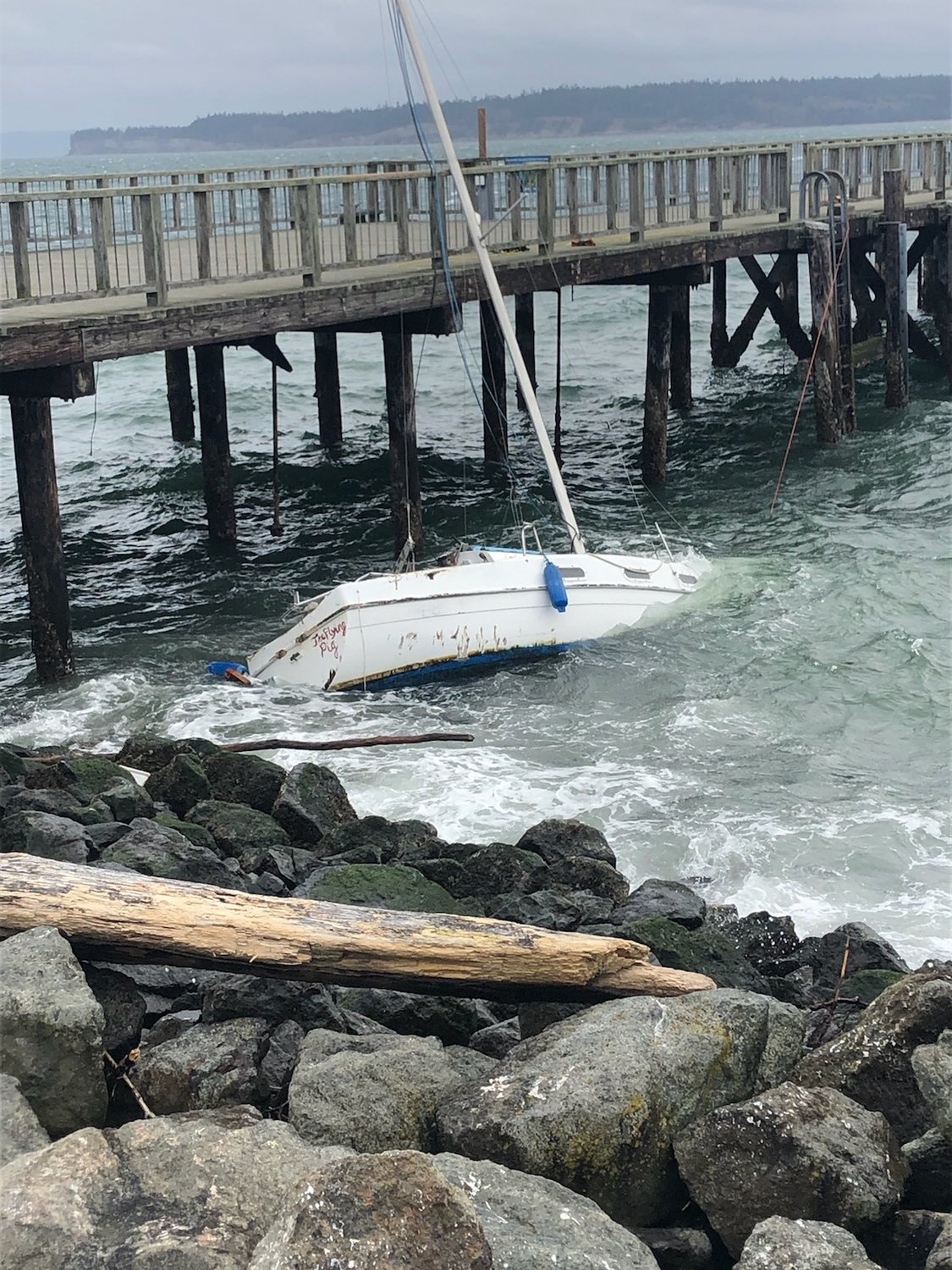 A sailboat bearing the name “Flying Pig” met an unfavorable fate Sunday near the city dock.
